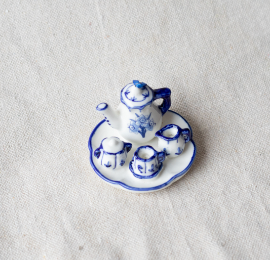 Ornament of a miniature blue and white ceramic tea set.