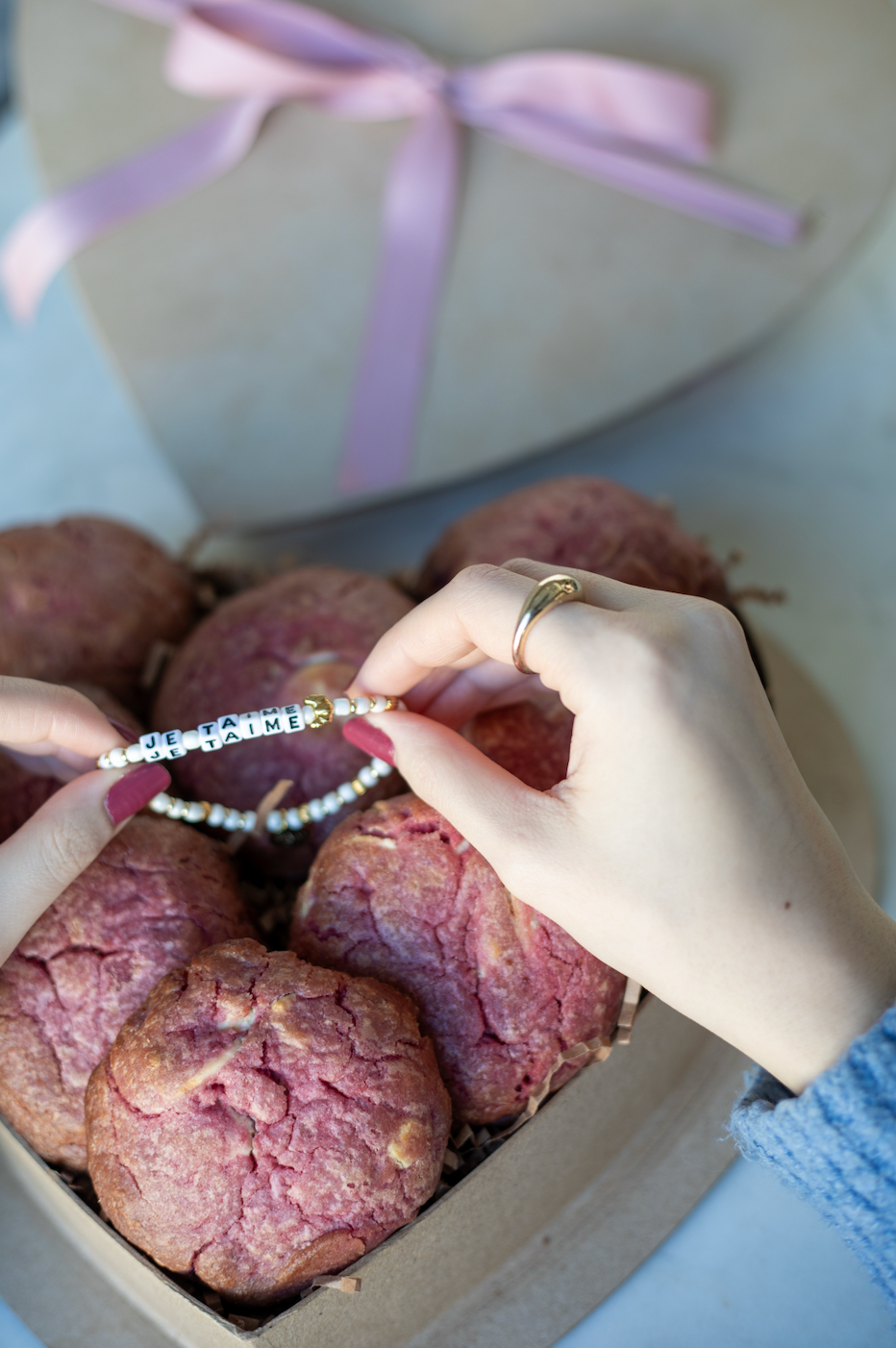 Heart-shaped box with nutty chocolate chip and white chocolate raspberry rose cookies; tied with pink ribbon - featuring je taime little words project bracelet